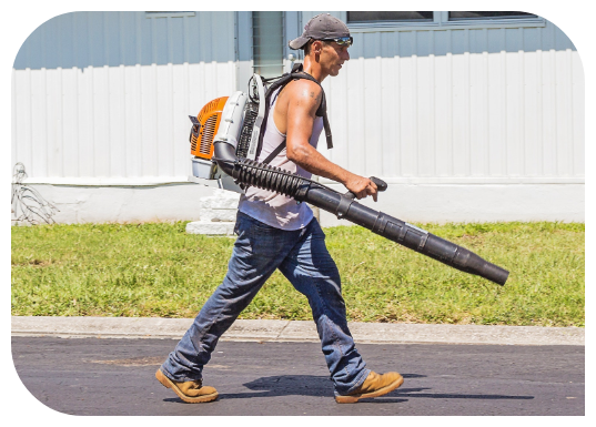 man-in-white-tank-top-and-blue-denim-pants-with-leaf-blower-162564