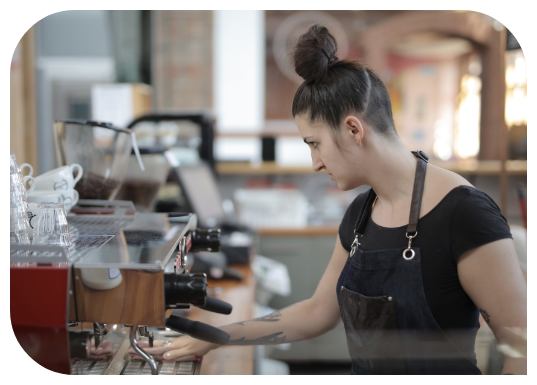 woman-cleaning-the-coffee-machine-3914073